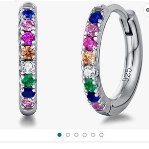 14k white gold plated sterling silver hoop earrings.